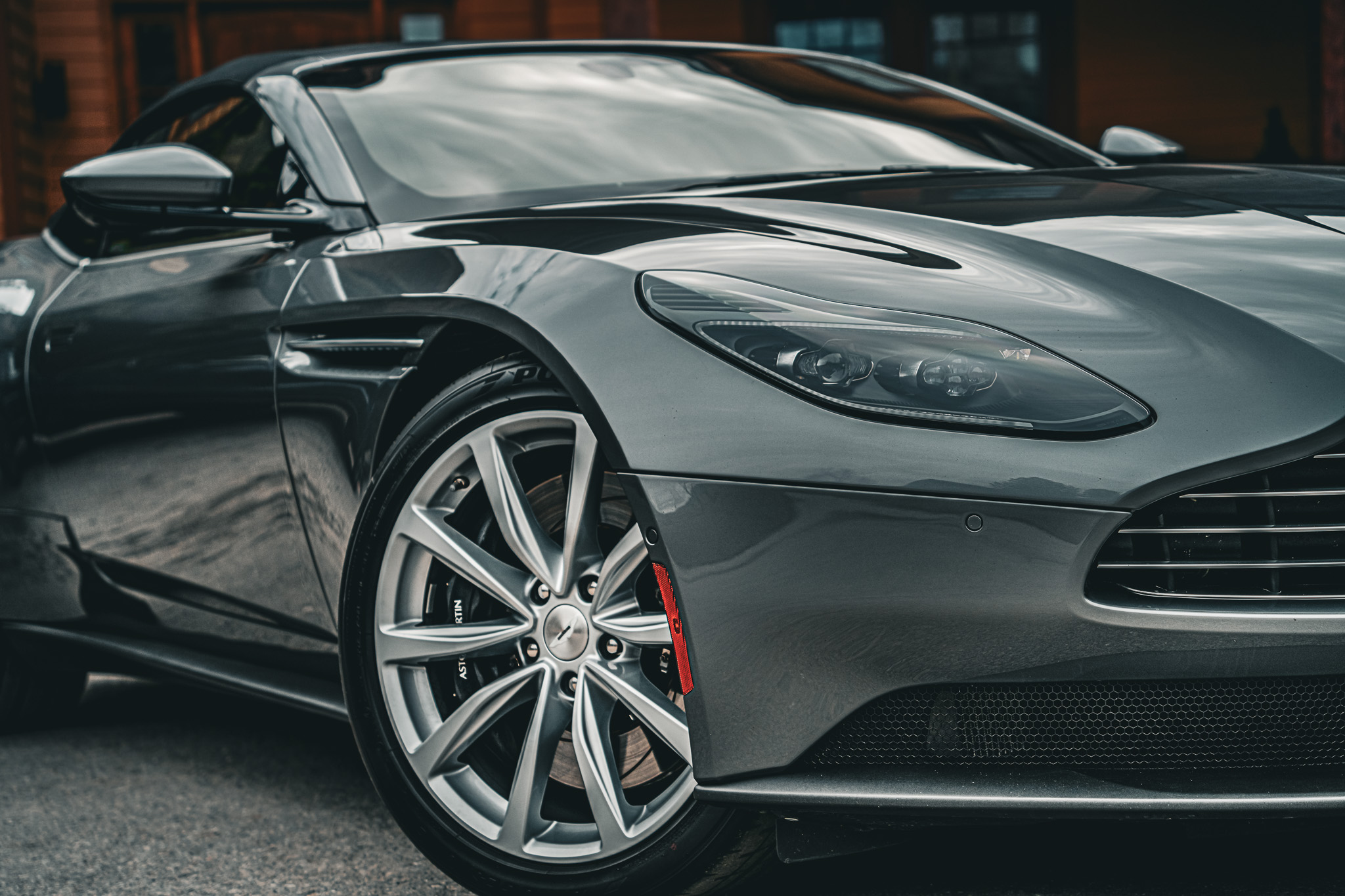 Detail of a silver Aston Martin