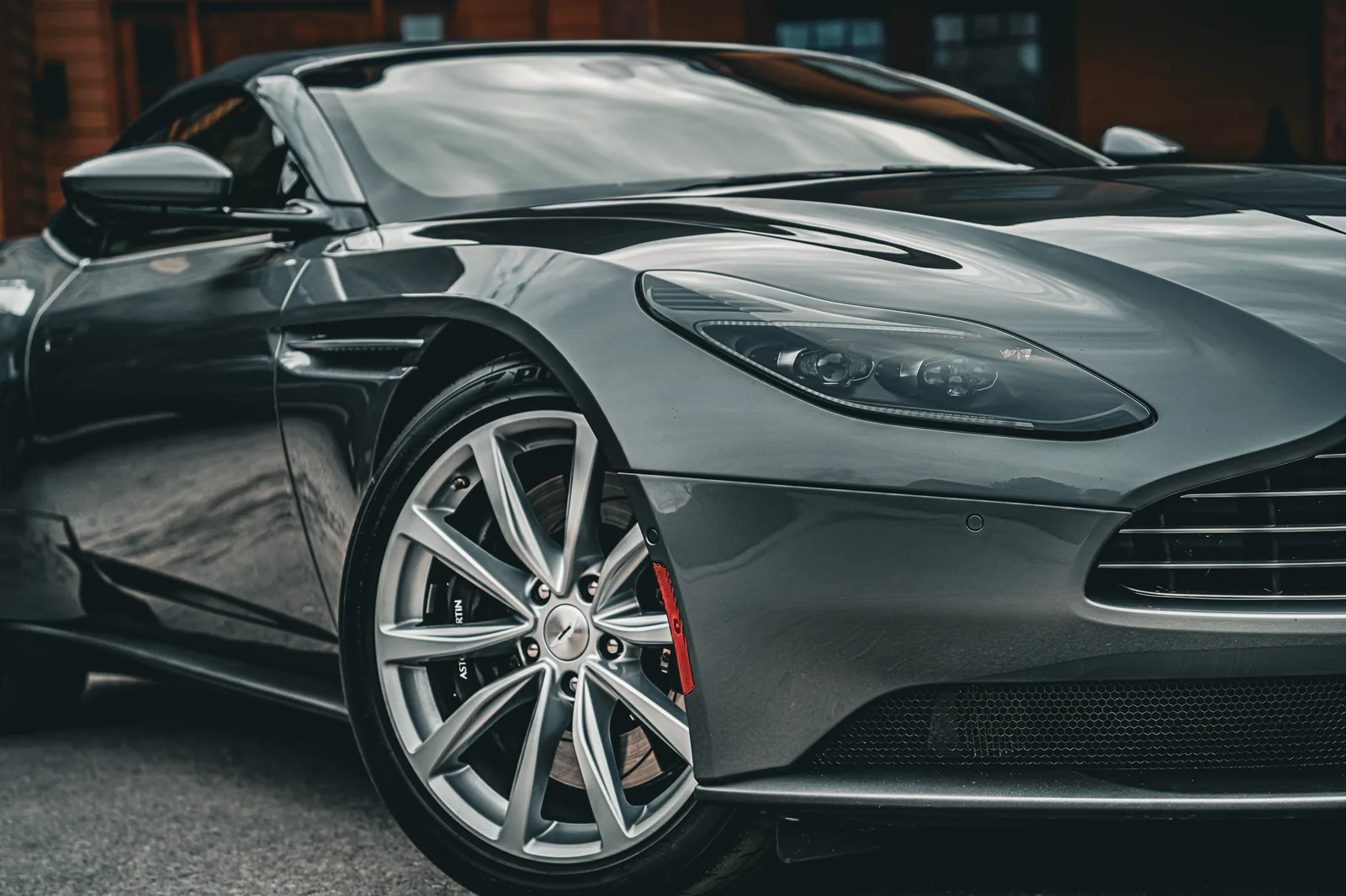 Detail of a silver Aston Martin